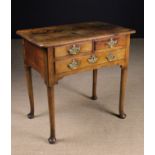 A Charming George II Walnut Lowboy of good mellow colour and patination.