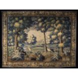 A Late 17th Century Verdure Tapestry depicting a Parkland scene with two birds to the foreground