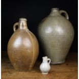 Three 17th Century Stoneware Flagons: A large bulbous grey glazed flagon with ring turning to the