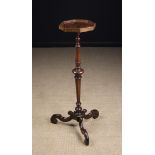 An Early 18th Century Walnut Candlestand.