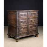 A Late 17th Century Oak Two Part Chest of Drawers with decorative moulding.