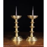 A Pair of Gothic Pricket Candlesticks with traces of residual gilding, Circa 1500.