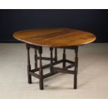 An 18th Century Oak Gateleg Table.