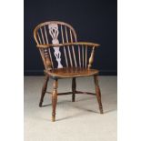 A 19th Century Nottinghamshire Yew-wood Hoop-back Windsor Armchair stamped Nicholson Rockley (fl