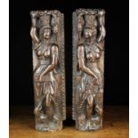 A Pair of Relief-Carved Figural Pilasters depicting female figures possibly Ceres holding a bunch