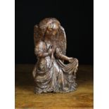 A Late Gothic English Carved Oak Angel, Circa 1480, 10½ in (26.5 cm) in height.