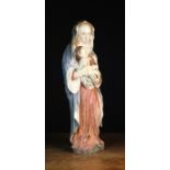 A 16th Century Polychromed Carving of Virgin & Child.