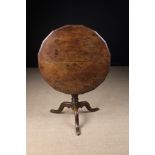 An Unusual 18th Century Oak Tilt top Tripod Table.