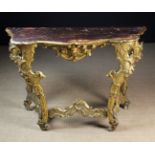 An 18th Century Italian Carved Giltwood Console Table.