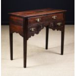 A George III Oak Lowboy.