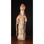 A 16th Century Polychromed Carving of a Bishop, 34 ins (86 cms) in height.