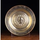 A 16th Century Nuremberg Type Brass Alms Dish with a portrait medallion to the centre encircled by