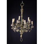 A Neo-Gothic Brass Twelve Branch Chandelier.