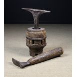 Two Antique Anvils: one mounted in a solid oak barrel-shaped Capstan bound in iron straps,