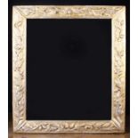 A Rectangular Wall Mirror in a carved and gilded frame decorated with oak leaves and acorns,