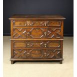 A Charles II Moulded Oak Chest of Drawers in two sections.