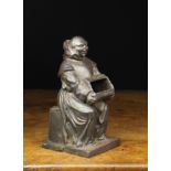 A 19th Century French Iron Offertory Chest Mount cast in the form of a monk sat upon a chest