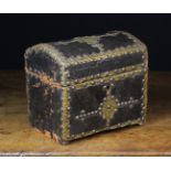 An Antique 17th Century Style Dome topped Casket clad in leather and adorned with hammered sheet