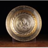 A Brass Nuremberg Alms Dish with faint traces of gilding.