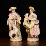 A Pair of Meissen Porcelain Figures modelled as a Shepherd & Shepherdess dressed in intricately