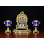 A Late 19th Century Paris Porcelain and Gilt Bronze Clock Set.