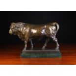 A Brown Patinated Brown Bull standing on a rectangular base signed B.C.