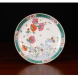 An Oriental Polychrome Enamelled Plate decorated with rock-work, peonies,
