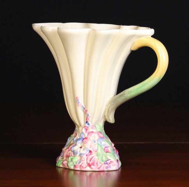 A Clarice Cliff 'My Garden' Pattern Ewer with a side handle and flared reeded body on a moulded