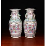 A Pair of 19th Century Cantonese Baluster Vases decorated in polychrome enamels with figural panels
