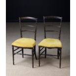 A Pair of 19th Century Ebonised Side Chairs painted with gilt stringing.