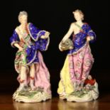 A Pair of 19th Century Continental Hard Paste Porcelain Figures (A/F) wearing elaborately decorated