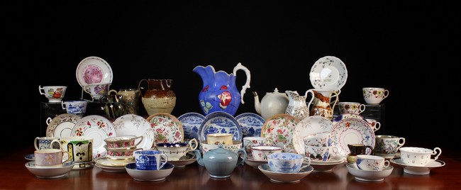 An Assortment of Decorative 19th Century Cups, Saucers, Jugs,
