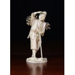 A Fine 19th Century Japanese Ivory Carving of a Woodman with Axe carrying a bundle of sticks