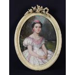 A Small 19th Century Oval Oil on Canvas: Portrait of a Spanish Lady wearing a pink roses in her