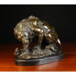 A Brown Patinated Bronze Study of a Lion and Snake on a naturalistic base signed B.C.