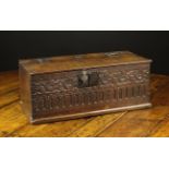 A 17th Century Boarded Oak Desk Box of rectangular form. The lid on iron butterfly hinges.