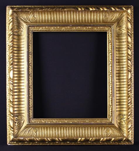An 18th Century Carved Giltwood Frame with nulled moulding and foliate motifs to the corners,