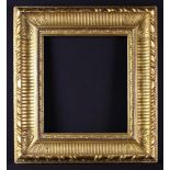 An 18th Century Carved Giltwood Frame with nulled moulding and foliate motifs to the corners,