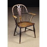 A 19th Century Ash & Elm Low-backed Windsor Armchair with a decorative pierced centre splat flanked