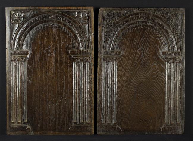 A Pair of James I Arcaded Oak Panels with incised decoration,