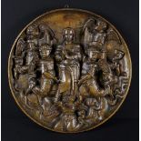 A 17th Century Dutch Relief Carved Oak Roundel depicting Mary surrounded by winged angels,