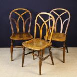 Three 19th Century Hoop-back Windsor Side Chairs with Gothic tracery back designs,