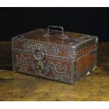A Charming 17th Century Leather Clad Box embellished with iron and brass studs;