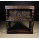 A 17th Century Carved Oak Livery Cupboard.