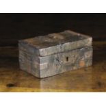 A Small 17th Century Iron Bound Wooden Box with strap hinges,