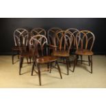 A Set of Eight 19th Century Ash, Elm & Fruitwood Windsor Chairs; seven side chairs and an armchair.