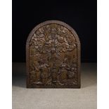 A Large 17th Century Flemish Arch-topped Oak Panel carved in relief with Christ & Mary knelt either