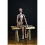 An Early 19th Century Treen Small Dark Pine Artists Lay Model with articulated limbs and an