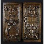 A Pair of 16th Century Carved Oak Panels with grimacing face masks; one with wing ears,