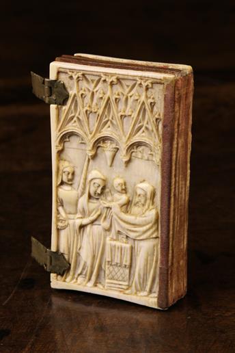 A Small Late 14th/15th Century Carved Ivory Book Cover encasing five boxwood leaves.